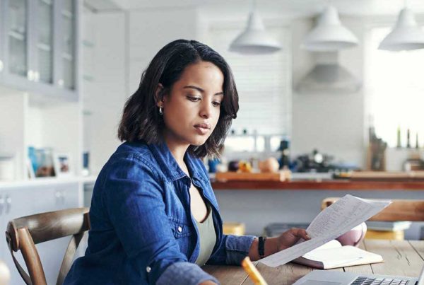 woman writing and reading at the same time