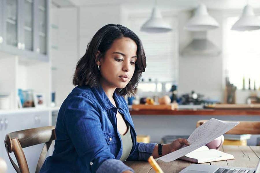 woman writing and reading at the same time